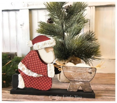 Unfinished kit measures apx. 8” tall and 11” wide and includes wooden MDF
•Santa, beard and arm overlay 
•baby Jesus 
•base 