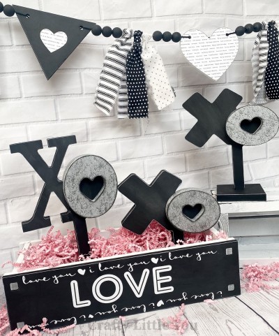 Unfinished kit measures apx. 12" tall on the tallest XO Kit includes 3 wooden XO on stands and over lay 

