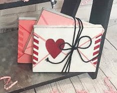 Unfinished kit measures apx. 5"x4" and includes wooden MDF: 
* 3 Envelopes
* 3 Vinyl Stencils