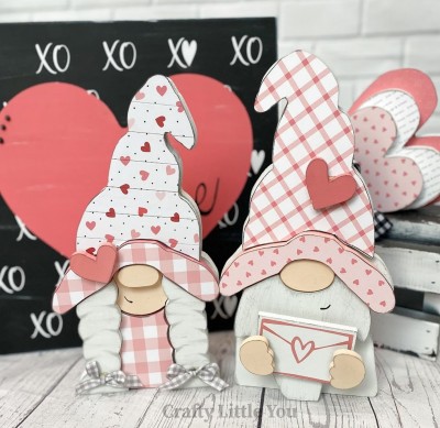 Unfinished kit includes wooden MDF:
* 2  hats
* 2 brims
* 2 hearts
* 1 dress
* 1 envelope
* 1 vinyl stencil for envelope
* 10 velcros