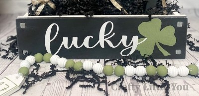 Unfinished kit measures apx. 13.5"x5" and includes wooden MDF: 
* Wooden sign with holes
* White vinyl (shamrock is stencil) 