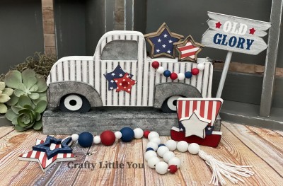 Unfinished kit measures apx. 4" tall
Kit includes 2 stars, hat with star,sign, vinyl stencil, and dowel
*Cut your own banner out of scrapbook paper.
*truck sold separately