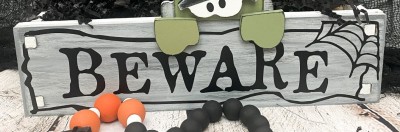 Unfinished kit measures apx. 13.5"x5" and includes wooden MDF: 
* Wooden sign with holes
* Black vinyl