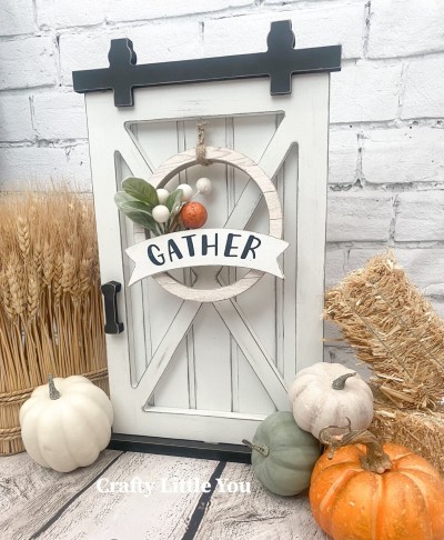 Unfinished kit measures apx. 5.5” and includes wooden MDF
•wreath
•pennant overlay
•black “Gather” vinyl
