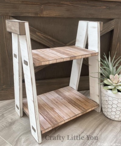 Unfinished kit measures 12.25" x 7"  tall and includes wooden MDF:
* (2) Shelf Pieces with Pegs
* (4) Tapered Legs
* (2) Hinge Covers

