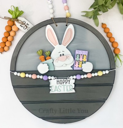 Unfinished kit measures apx. 7" tall and includes wooden MDF:
* 1 bunny main piece with grooves
* 1 cheek and tooth overlay
* 1 nose overlay
* 1 carrots in pot overlay
* 1 peeps in package overlay
* 2 hands overlays
* 1 sign
* Black vinyl (some is stencil) 
* 2 pieces Velcro 
