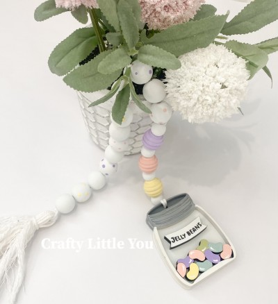 Unfinished kit measures apx. 3" and includes wooden MDF:
* 1 jelly bean jar back piece
* 1 jar overlay with etched lid and attached jelly beans
* 1 banner overlay
* Black vinyl