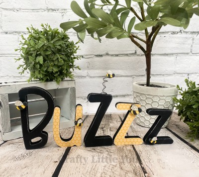 Unfinished kit measures apx. 5" tall and includes wooden MDF: 
* 5 wooden letters
* 5 bee overlays