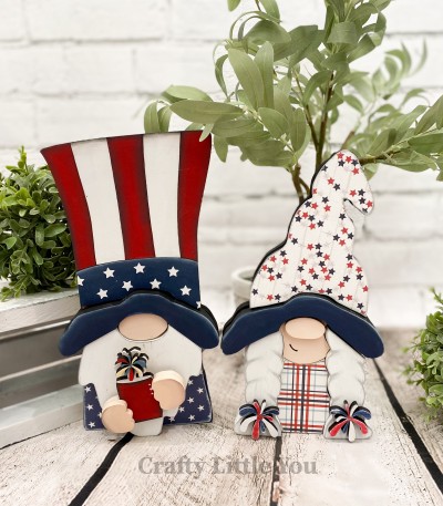 Unfinished kit includes wooden MDF:
* 1 Girls gnome hat
* 1 Uncle Sam hat
* 2 Firework hair ties
* 1 Firework overlay
* 1 Dress
* 1 Firework burst overlay
* 10 dot Velcros
* White vinyl stars