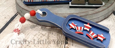 Unfinished kit measures apx. 5.75" and includes wooden MDF: 
* 1 scoop with rim overlay
* 3 miniature stars with engraved stripes
* 2 miniatures hats with engraved stripes and brim