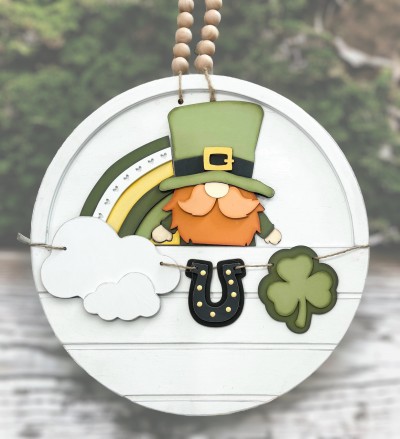 Unfinished kit measures apx. 7" tall and includes wooden MDF:
*1 leprechaun main piece
*1 hat brim overlay
*1 hat buckle overlay
*1 beard overlay
*1 nose overlay
*2 mustache pieces
*1 main piece rainbow
*2 rainbow arc overlays (one with hollowed out hearts)
*2 clouds
*2 horseshoes
*2 shamrocks
*2 pieces Velcro