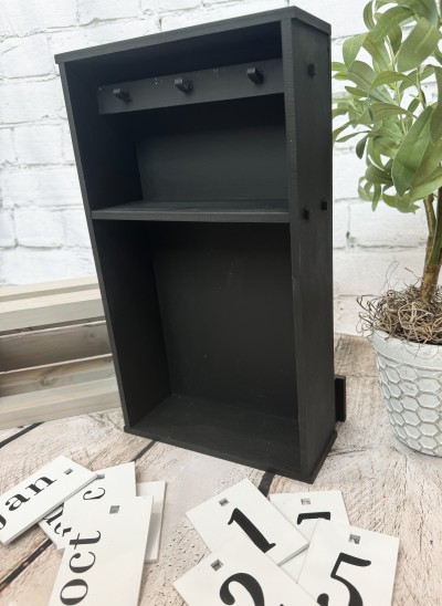 Unfinished kit measures apx. 7.5"x13" and includes wooden MDF: 
*10 wood pieces that make The Box Calendar
*3 pegs
*12 double-sided rectangular tags
(6 for months, and 6 for dates)
*Black vinyl for month and days
(Jan - Dec, 0,1,1,2,2,3,4,5,6,7,8,9)
*Assembly instructions
