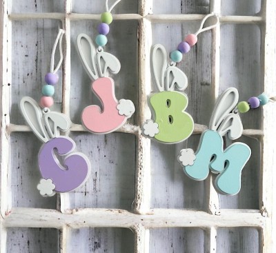 Unfinished kit measures apx. 4.5" and includes wooden MDF:
*1 back piece
*2 bunny ear overlays
*1 bunny tail overlay
*1 personalized letter
 (Please make sure to specify what letter is wanted when ordering.)