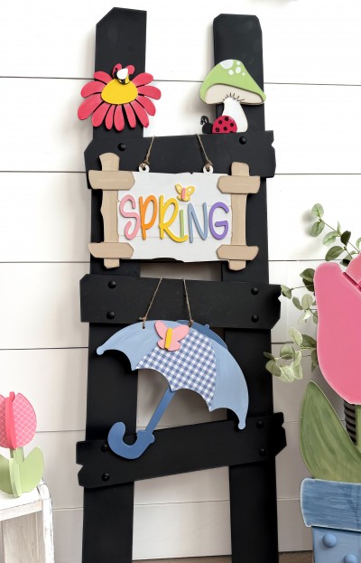Unfinished kit measures 10" tall on Umbrella and includes wooden MDF:*1 umbrella *1 set of umbrella  overlays  *1 large butterfly *1 Sign with overlays *1 “SPRING” wood lasered letters *1 small butterfly *1 mushroom with overlays *1 lady bug *1 flower with overlay center *1 bee