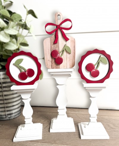 Unfinished kit is 5.5" on board and includes wooden MDF: *2 circles with frame overlay *1 charcuterie board *3 cherries *1 bow